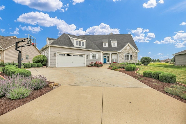 2955 E Stone Creek Blvd, Urbana, IL 61802 - view of front of property with a front lawn, driveway, and an attached garage