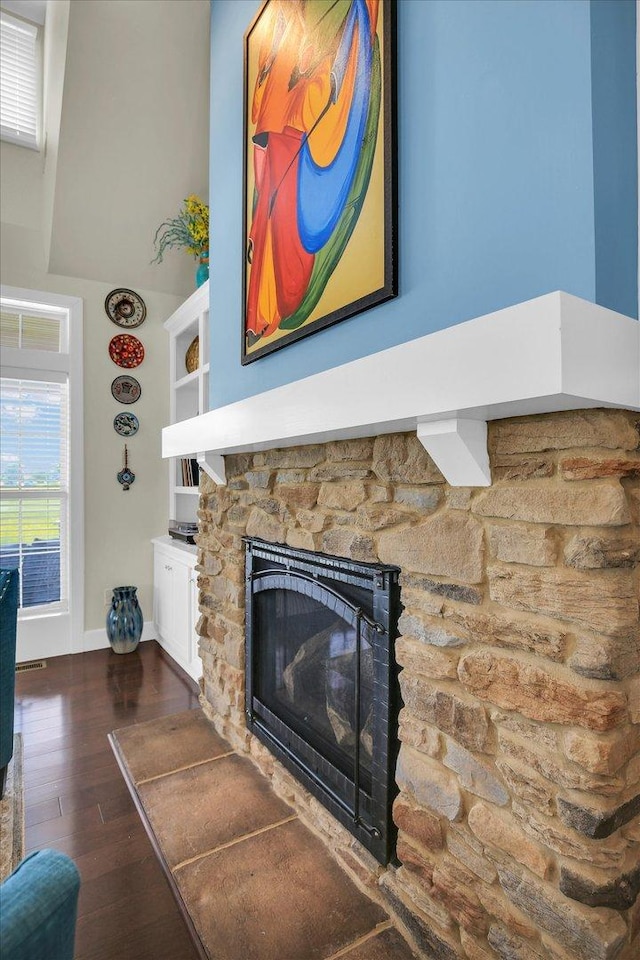 2955 E Stone Creek Blvd, Urbana, IL 61802 - living room featuring a stone fireplace and wood finished floors