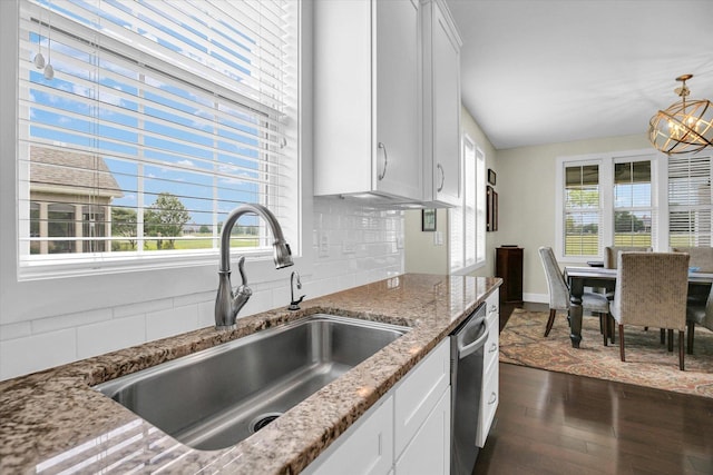 2955 E Stone Creek Blvd, Urbana, IL 61802 - kitchen featuring dishwasher, dark wood-type flooring, a chandelier, light stone countertops, and white cabinetry