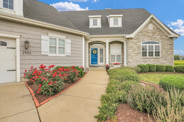 2955 E Stone Creek Blvd, Urbana, IL 61802 - property entrance featuring roof with shingles and stone siding