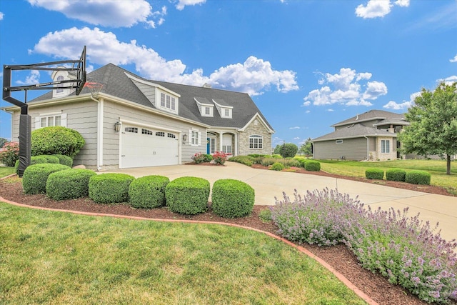 2955 E Stone Creek Blvd, Urbana, IL 61802 - view of front of property featuring a front yard, driveway, and a garage