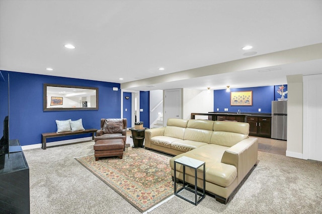 2955 E Stone Creek Blvd, Urbana, IL 61802 - living room with light carpet, recessed lighting, bar area, and stairs