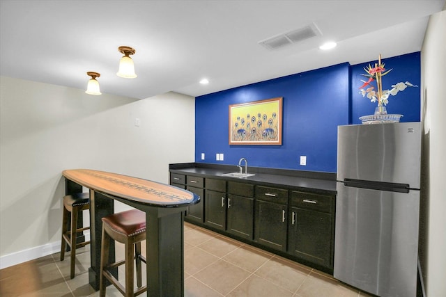 2955 E Stone Creek Blvd, Urbana, IL 61802 - indoor wet bar featuring freestanding refrigerator, light tile patterned floors, and recessed lighting