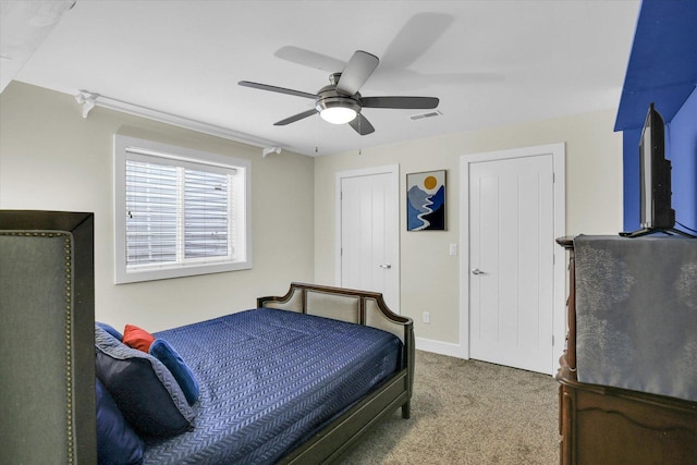 2955 E Stone Creek Blvd, Urbana, IL 61802 - carpeted bedroom featuring a ceiling fan and baseboards