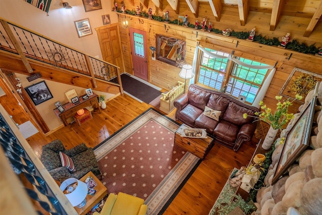 13153 E 1920 N Rd, Pontiac, IL 61764 - living room featuring wood finished floors, wood walls, stairway, and a towering ceiling