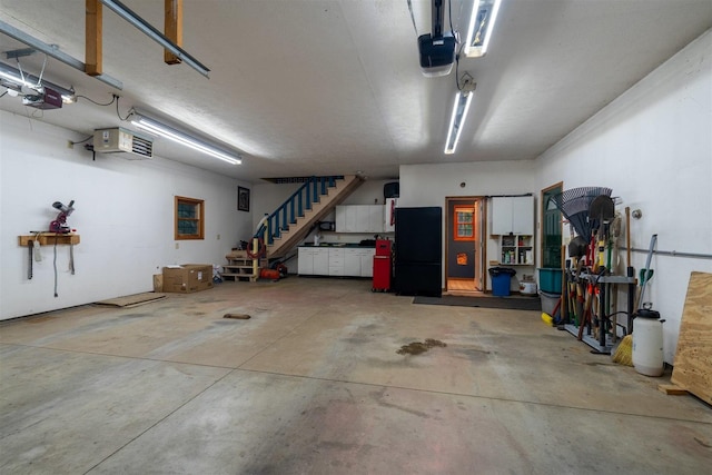 13153 E 1920 N Rd, Pontiac, IL 61764 - garage with a garage door opener, freestanding refrigerator, and a heating unit