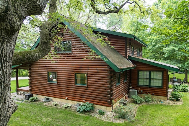 13153 E 1920 N Rd, Pontiac, IL 61764 - view of side of property with log exterior and a lawn