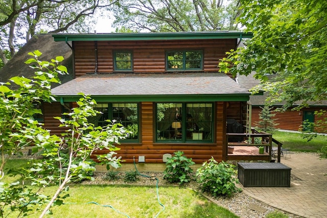 13153 E 1920 N Rd, Pontiac, IL 61764 - view of front of property featuring roof with shingles, faux log siding, and a patio