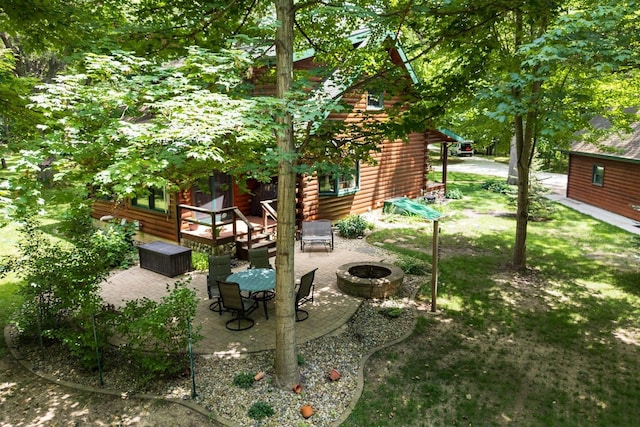 13153 E 1920 N Rd, Pontiac, IL 61764 - view of yard featuring an outdoor fire pit, a patio, and a deck