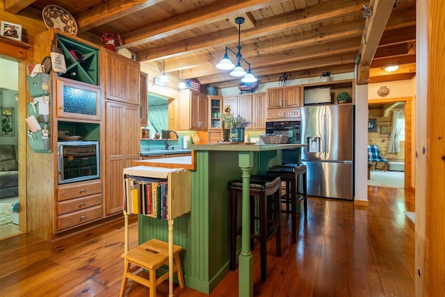13153 E 1920 N Rd, Pontiac, IL 61764 - kitchen with stainless steel fridge, a wooden ceiling with exposed beams, oven, dark wood-type flooring, and a kitchen island