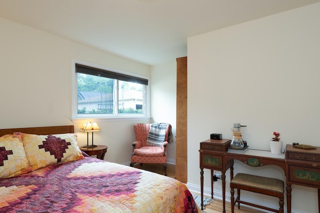 2417 Lyons St, Evanston, IL 60201 - bedroom with wood finished floors and baseboards