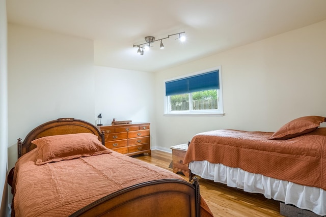 2417 Lyons St, Evanston, IL 60201 - bedroom with wood finished floors and track lighting