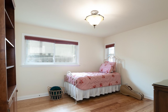 2417 Lyons St, Evanston, IL 60201 - bedroom with light wood-style flooring and baseboards