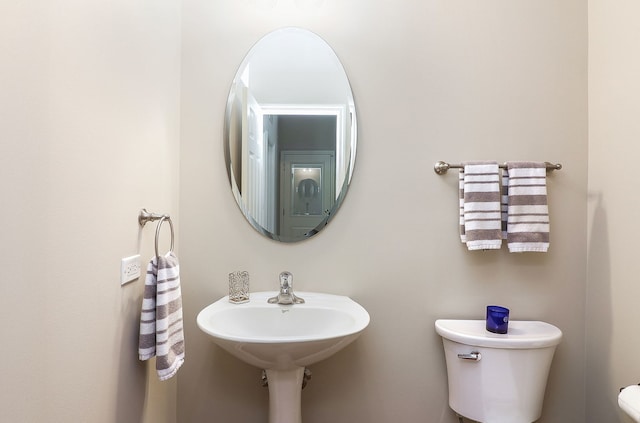606 Ebony Dr, Oswego, IL 60543 - half bathroom featuring toilet