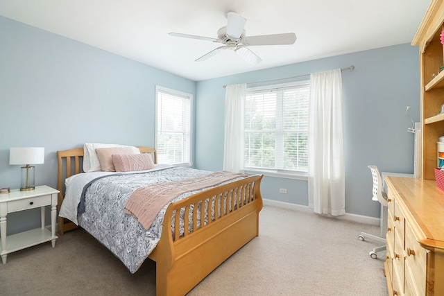 606 Ebony Dr, Oswego, IL 60543 - bedroom with light colored carpet and ceiling fan