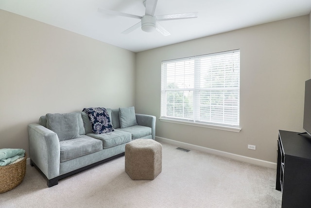 606 Ebony Dr, Oswego, IL 60543 - living room featuring light colored carpet and ceiling fan
