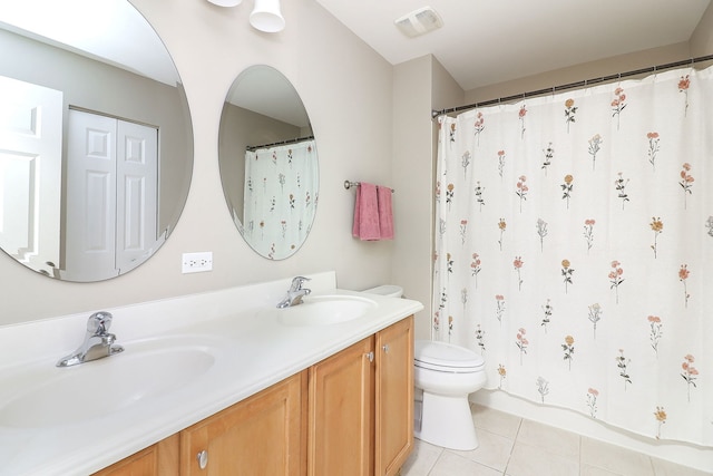 606 Ebony Dr, Oswego, IL 60543 - bathroom featuring double vanity, tile patterned flooring, and a shower with curtain