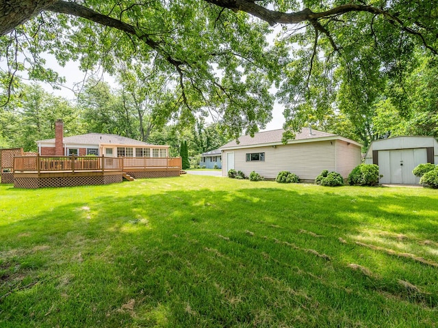 566 Glendale Ave, Wheaton, IL 60137 - view of grassy yard with a storage shed and a wooden deck