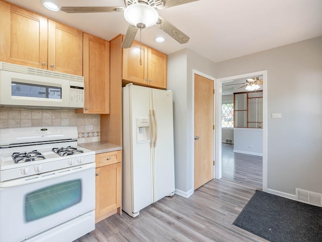 566 Glendale Ave, Wheaton, IL 60137 - kitchen with white appliances, a ceiling fan, decorative backsplash, light countertops, and light wood-style floors