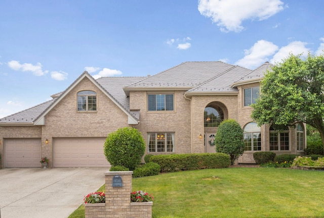 8025 Kirkcaldy Ct, Palos Heights, IL 60463 - traditional home with concrete driveway, a front lawn, brick siding, and a garage