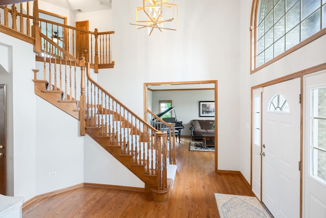 8025 Kirkcaldy Ct, Palos Heights, IL 60463 - entrance foyer featuring a high ceiling, wood finished floors, stairway, and a chandelier