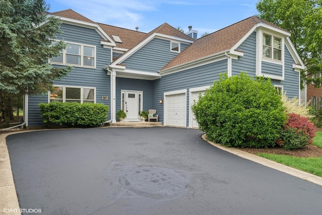 1580 Verde Ln, Mundelein, IL 60060 - traditional home featuring asphalt driveway, a garage, roof with shingles, and a chimney