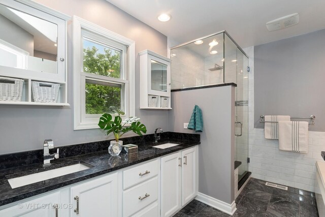 1580 Verde Ln, Mundelein, IL 60060 - bathroom featuring double vanity, a stall shower, marble finish flooring, and recessed lighting
