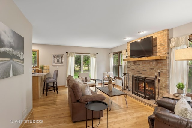1580 Verde Ln, Mundelein, IL 60060 - living area with a brick fireplace and light wood finished floors
