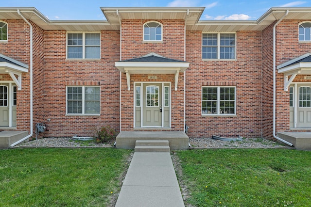 1610 Belclare Rd Unit 0, Normal, IL 61761 - view of front of property featuring a front yard and brick siding
