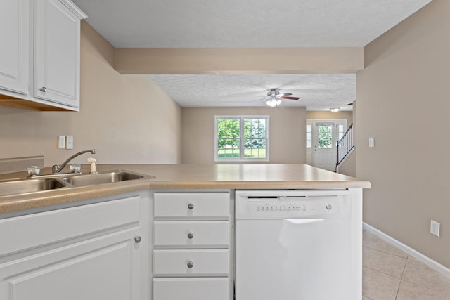 1610 Belclare Rd Unit 0, Normal, IL 61761 - kitchen with dishwasher, a peninsula, a textured ceiling, ceiling fan, and light tile patterned floors