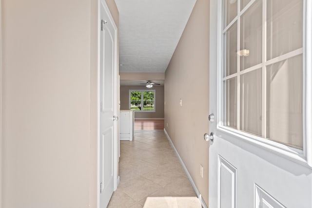 1610 Belclare Rd Unit 0, Normal, IL 61761 - hallway with light tile patterned floors and baseboards
