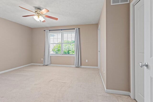 1610 Belclare Rd Unit 0, Normal, IL 61761 - carpeted spare room with a ceiling fan and a textured ceiling