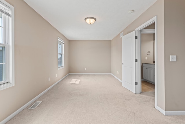 1610 Belclare Rd Unit 0, Normal, IL 61761 - empty room featuring light carpet and a smoke detector