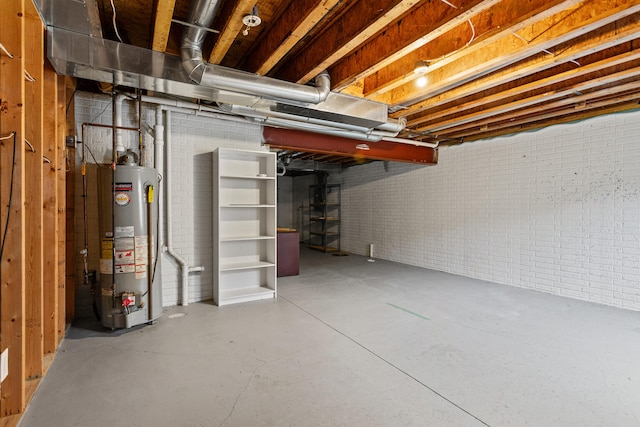1610 Belclare Rd Unit 0, Normal, IL 61761 - unfinished basement featuring water heater and brick wall