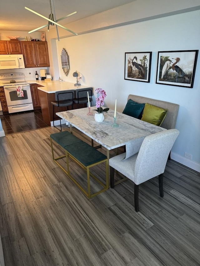 4250 N Marine Dr Unit 2607, Chicago, IL 60613 - dining space featuring dark wood-type flooring and baseboards