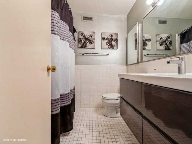 4250 N Marine Dr Unit 2607, Chicago, IL 60613 - full bathroom with tile walls, vanity, tile patterned flooring, and wainscoting