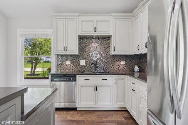 0N480 Winfield Scott Dr, Winfield, IL 60190 - kitchen featuring stainless steel appliances, tasteful backsplash, dark countertops, and dark wood-type flooring