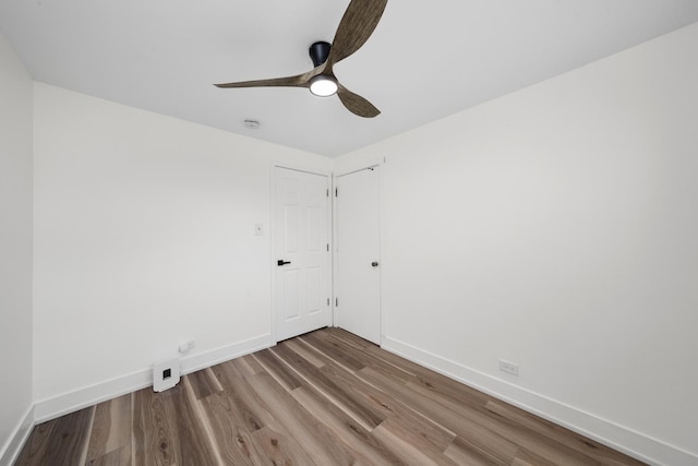 16030 University Ave, South Holland, IL 60473 - spare room featuring wood finished floors and a ceiling fan