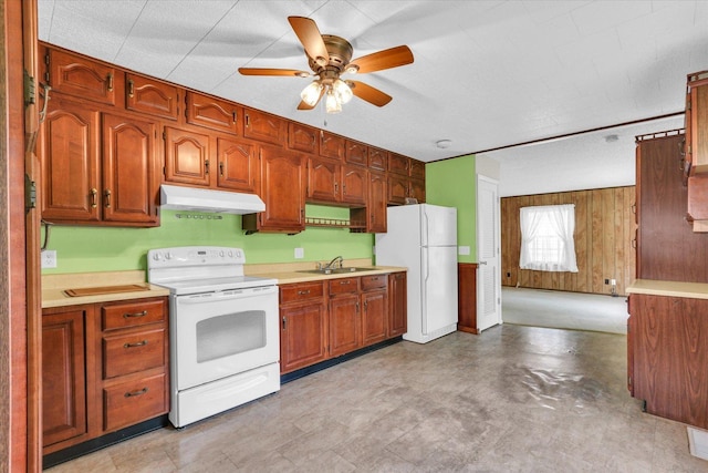 907 E Glenview Dr, Tuscola, IL 61953 - kitchen featuring white appliances, under cabinet range hood, ceiling fan, light countertops, and wood walls