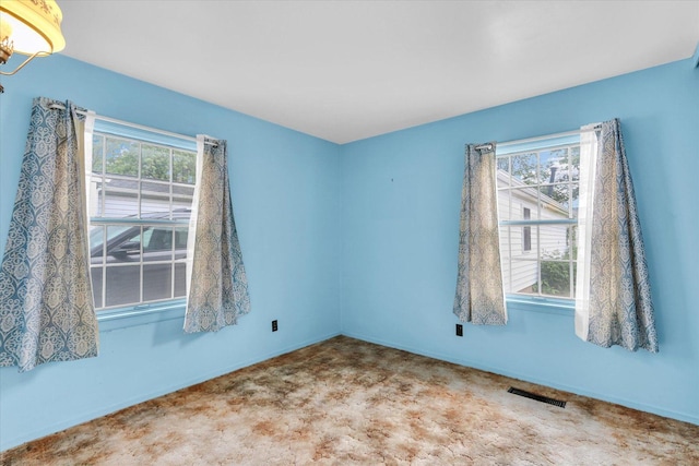 907 E Glenview Dr, Tuscola, IL 61953 - carpeted spare room featuring healthy amount of natural light