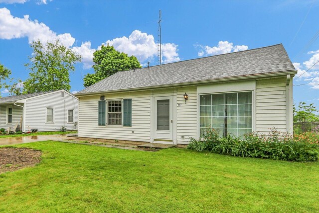 907 E Glenview Dr, Tuscola, IL 61953 - rear view of property with a lawn and a shingled roof