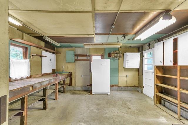 907 E Glenview Dr, Tuscola, IL 61953 - basement with a workshop area and freestanding refrigerator