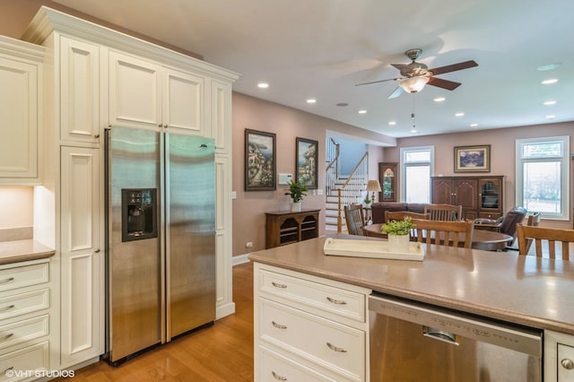 706 French Way Unit 2, Mount Prospect, IL 60056 - kitchen featuring appliances with stainless steel finishes, a ceiling fan, light wood-style floors, healthy amount of natural light, and recessed lighting