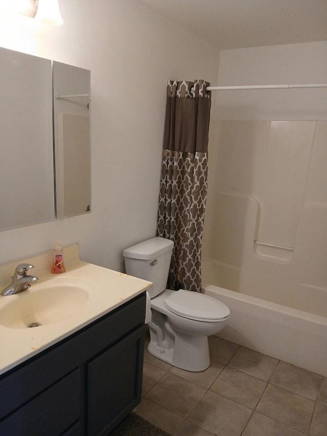 313 Manning Dr, Dekalb, IL 60115 - bathroom featuring vanity, shower / bath combo with shower curtain, and tile patterned flooring
