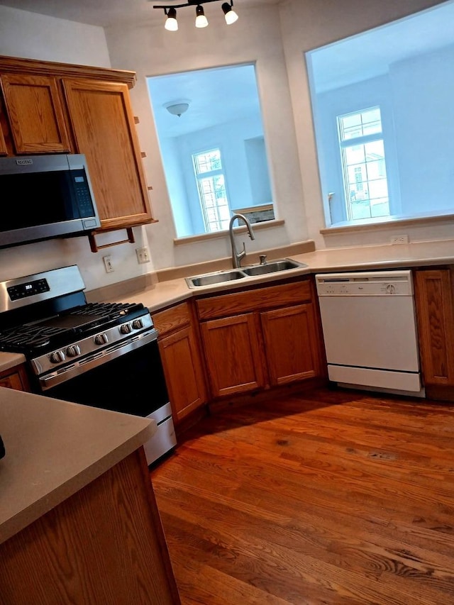 313 Manning Dr, Dekalb, IL 60115 - kitchen featuring stainless steel appliances, brown cabinetry, and dark wood-style floors