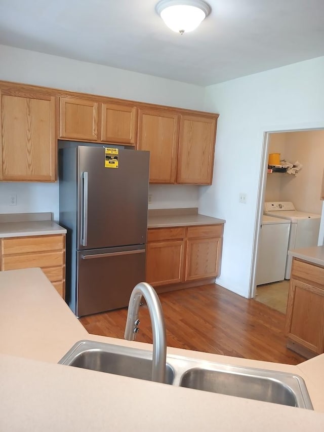 313 Manning Dr, Dekalb, IL 60115 - kitchen with freestanding refrigerator, independent washer and dryer, and light countertops