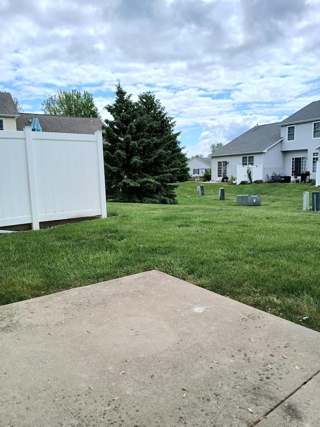 313 Manning Dr, Dekalb, IL 60115 - view of grassy yard featuring a patio