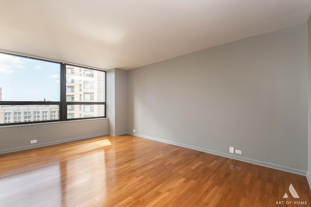 400 E Ohio St Unit 2302, Chicago, IL 60611 - unfurnished room with light wood-type flooring and baseboards