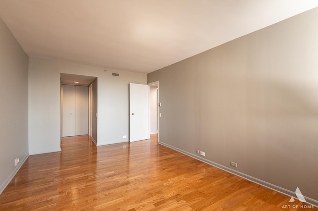 400 E Ohio St Unit 2302, Chicago, IL 60611 - spare room with light wood finished floors and baseboards