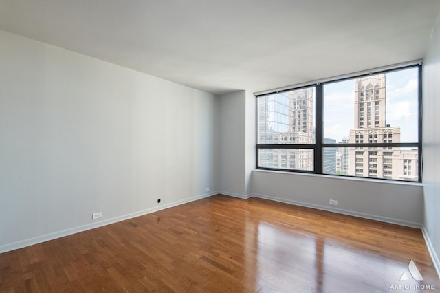 400 E Ohio St Unit 2302, Chicago, IL 60611 - empty room featuring wood finished floors and a city view